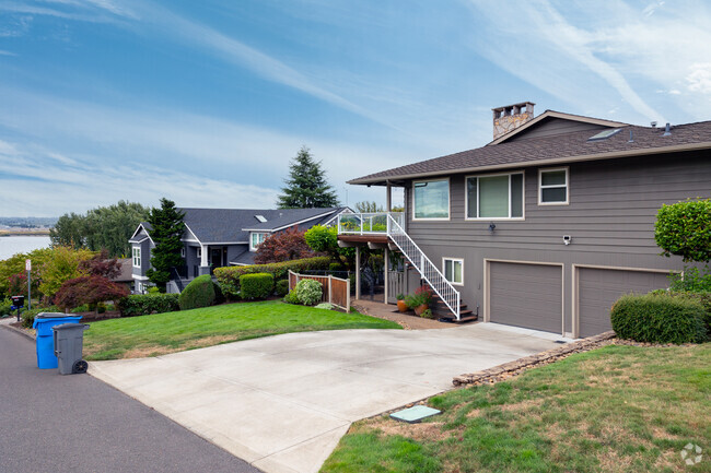 Riverview residents come home to homes with garages and porches with views along SE Chelsea Ave.