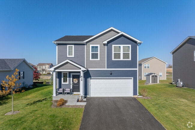 Modern New Traditional homes sit on well-kept Malta lawns.