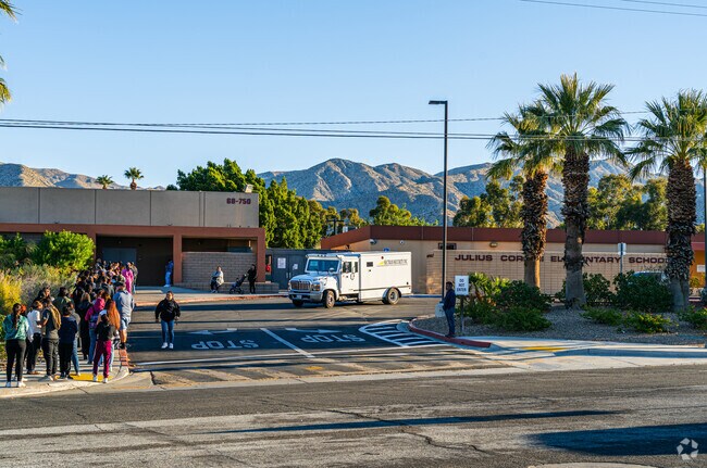 Families arrive early to drop off their kids at Julius Corsini Elementary School.