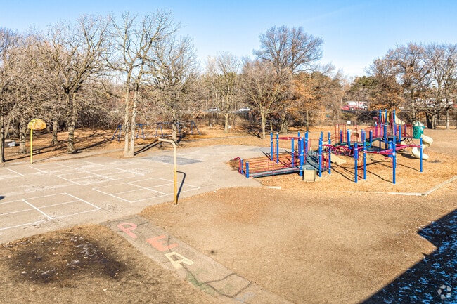 A large playground and play area serve students in the lower grades.
