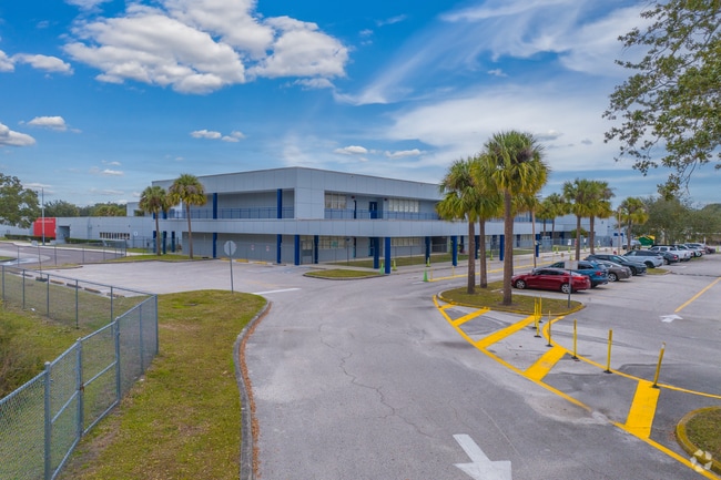 Cannella Elementary School has an entrance to the back of the school which leads to a gym.