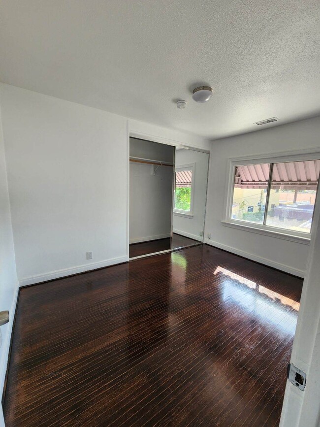 Second Bedroom with large closet with double mirrored doors