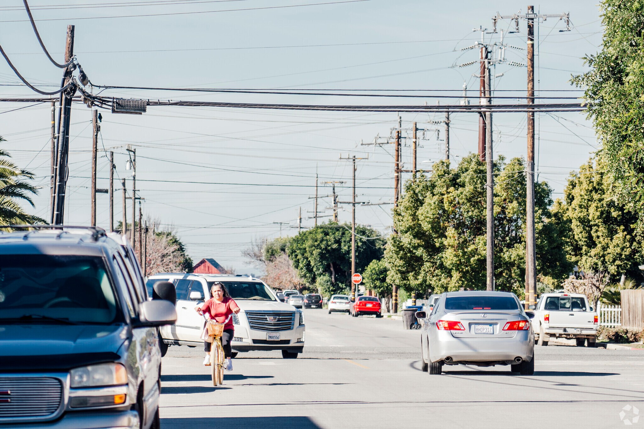 A biker riding around the neighborhood in Gonzales, California.