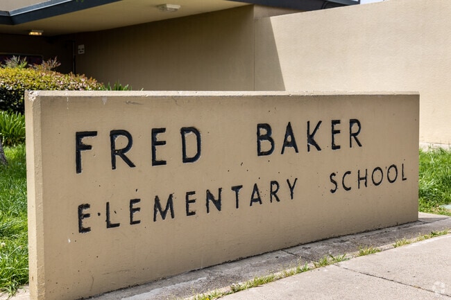 The Original Fred Baker Elementary Sign Stands behind the Display board located in Mountain View