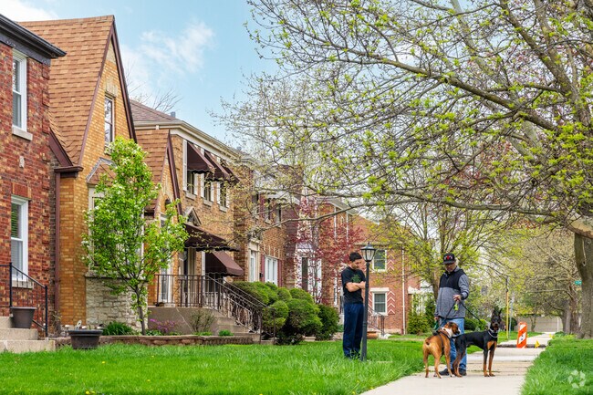 Galewood neighbors chat during a walk around the block.
