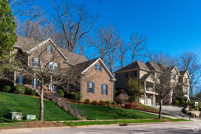 In Meadowmont, sidewalks are lined with lush foliage.