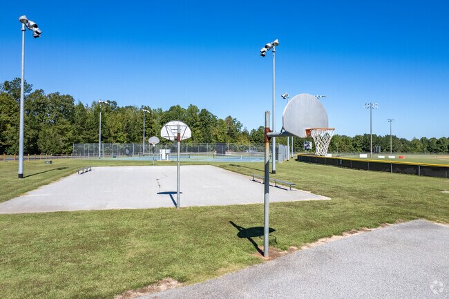 Lookout for pickup games at the basketball courts while baseball games are played.
