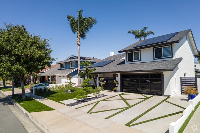 Modernized split level home with creative landscaping.