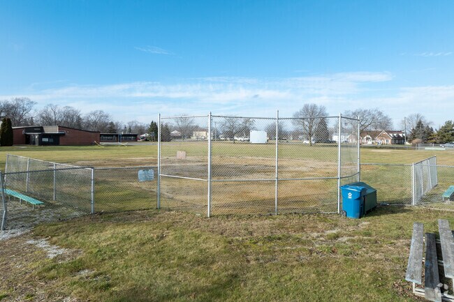 Watch the baseball game in the bleachers of Monee Education Center.