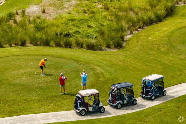 Residents meet to play Tarpon Boil Executive Golf Course near the Village of Tamarind Grove.