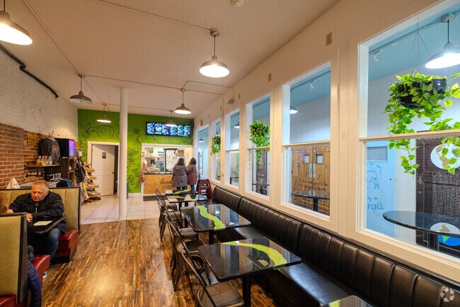 Locals eating at the Beautiful Whirld restaurant in downtown Historic Perkins neighborhood.