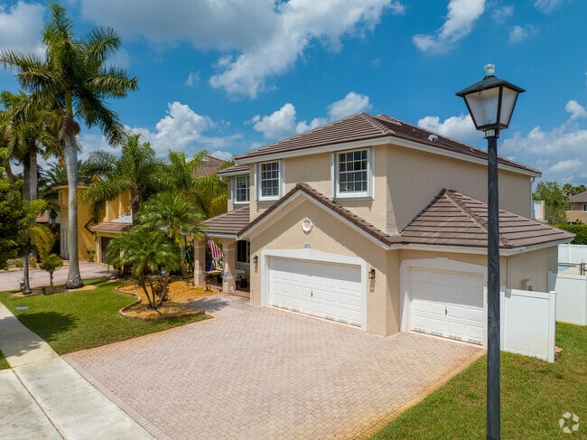 Mediterranean-style single-family homes with barrel roof tiles can be seen in Pembroke Shores.