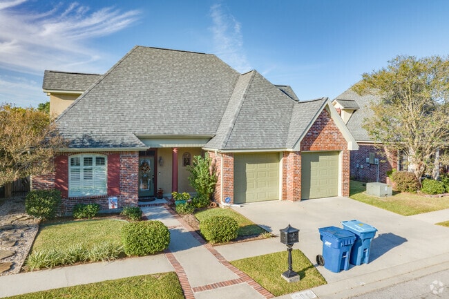 Two car garages and red brick cottage homes are seen all over Arnould Heights, Lafayette.