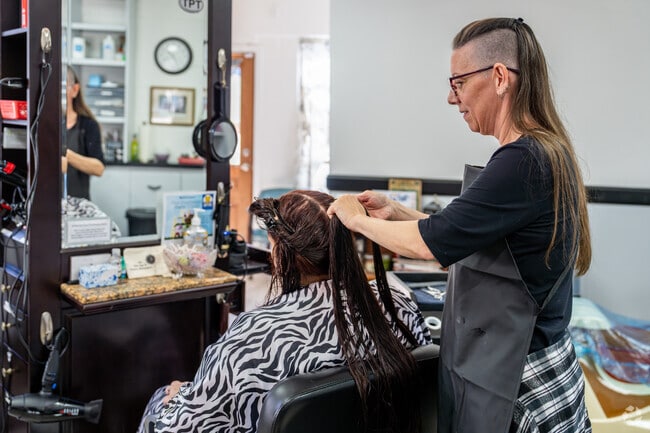 A woman has her hair styled at the Mountain Top Salon in Lake Hughes.