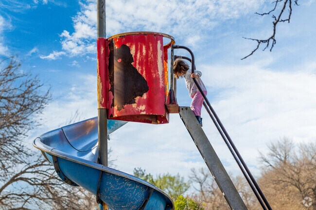 Kids love to run around at the playground in Sedgwick Country Park by Sherwood Glen.