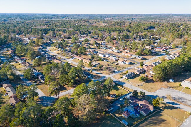 Subdivisions mix with wooded lots across Far North Columbia.