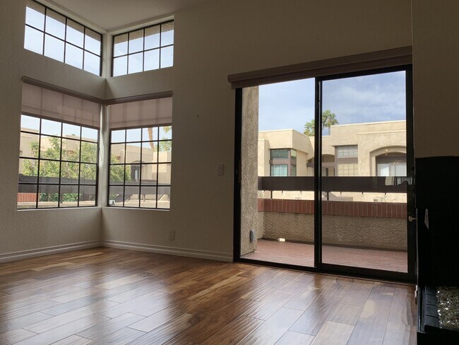 living room, balcony, fireplace facing north