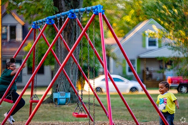 Rum Village kids can burn off some youthful energy at Kennedy Park's swing sets.