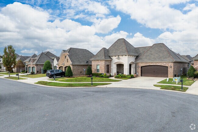 A row of homes sit along a quiet cul-de-sac road in Broussard, LA.