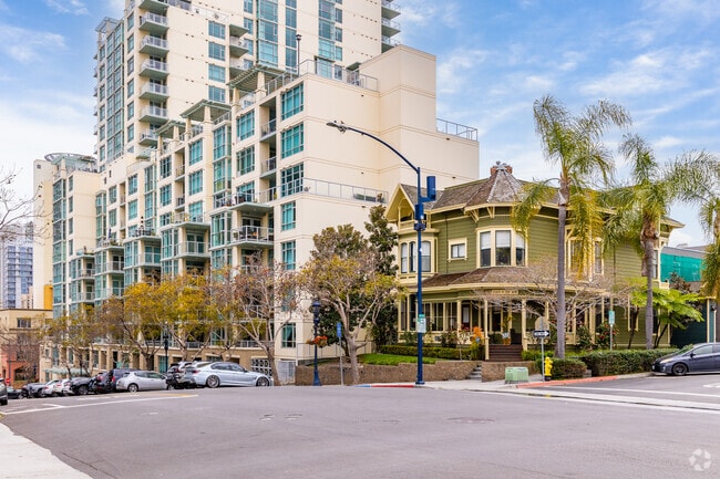 A Victorian styled home, the John Ginty House, is nestled between contemporary condos.
