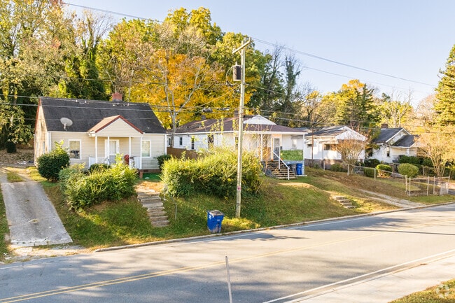 A busy street in Columbia Heights is lined with charming cottages.
