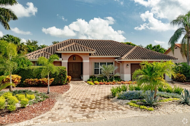 A beautifully landscaped Spanish style home in the Tropic Isle neighborhood in Delray Beach, FL.