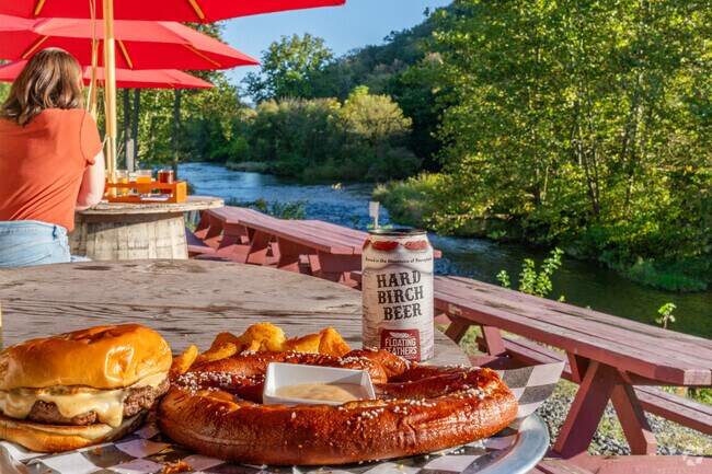 Curtin visitors enjoy Hard Birch Beer and pretzels at Floating Feathers Brewery’s taproom.