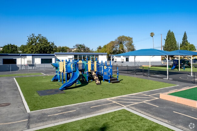 Playground with green space at Anne Darling Elementary.