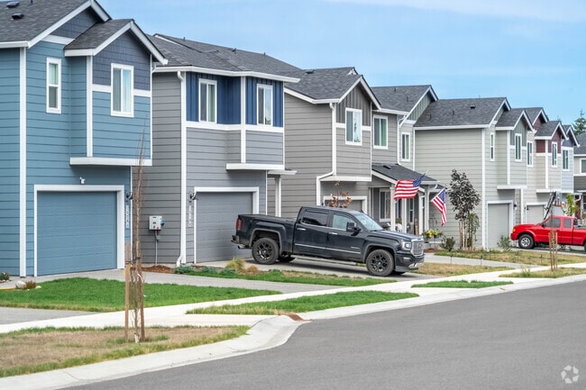 A row of contemporary homes in a quiet residential street in North Yelm.
