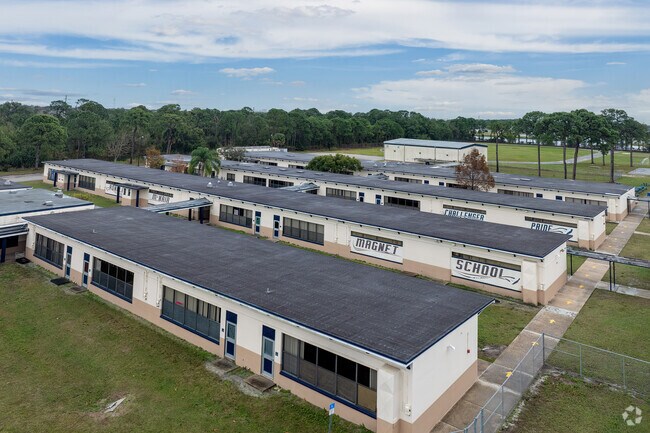 Sidewalks connect buildings hosting children at Ronald McNair Magnet Middle School.