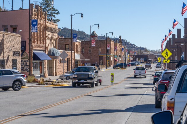 Residents enjoy the vibrant atmosphere of River Street in downtown Hot Springs.