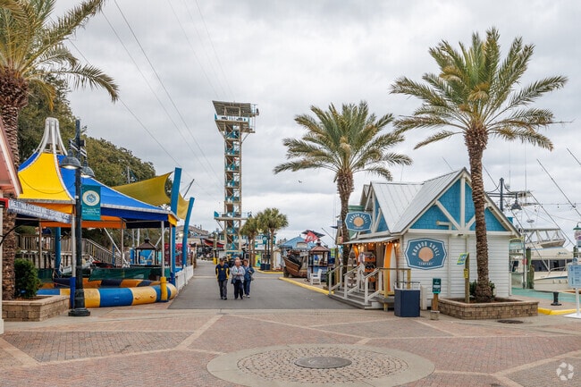 Boutique shops and fun games and rides offer a fun experience for all ages at Harborwalk Village in Destin.