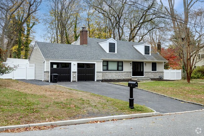 This Cape Cod is found in one of the quiet neighborhoods of Setauket.