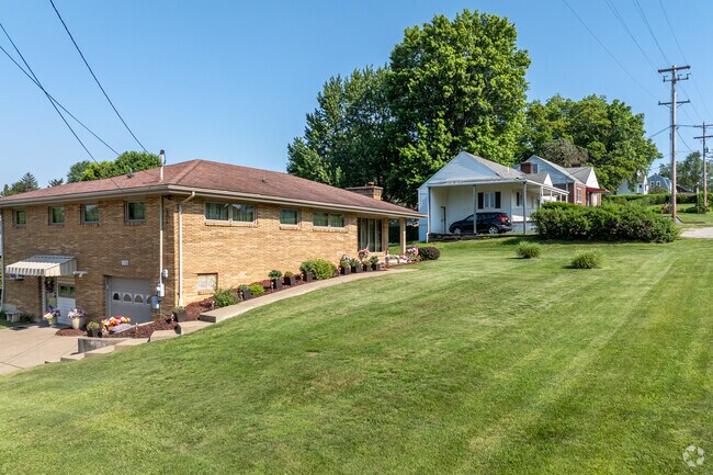 There are ranch-style homes on green lots in Saint Clairsville.
