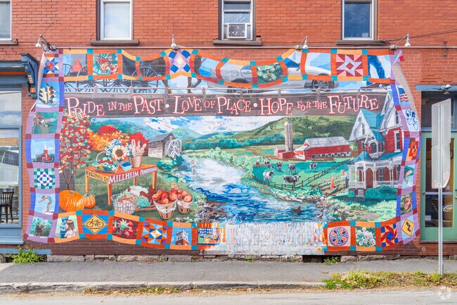 A colorful mural adorns a historic building in Millheim near Miles.
