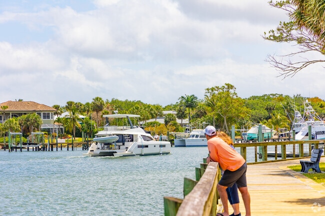 Port Salerno residents enjoy ocean air at the boardwalk in Sandsprit Park.