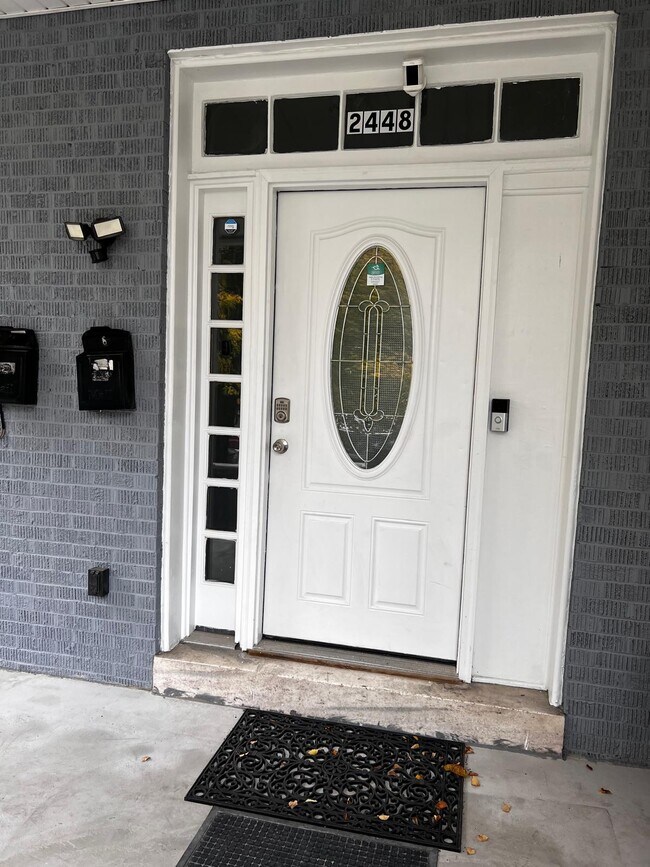 Main Entrance - new porch, stairs & privacy fence with gate
