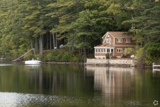 Residents fish near their lakeside home in Shapleigh.