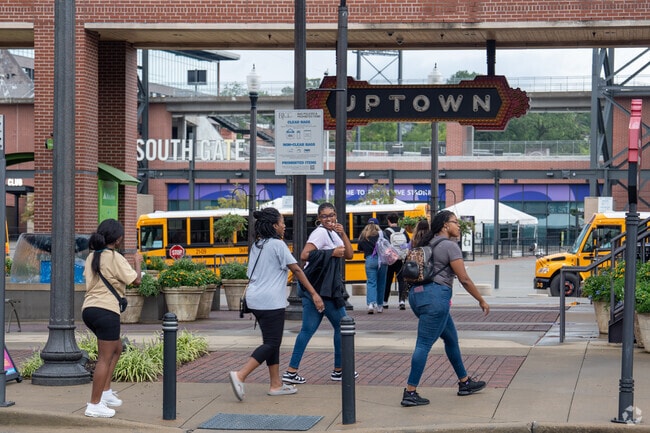 Take a walk with friends at Uptown next to Norwood.