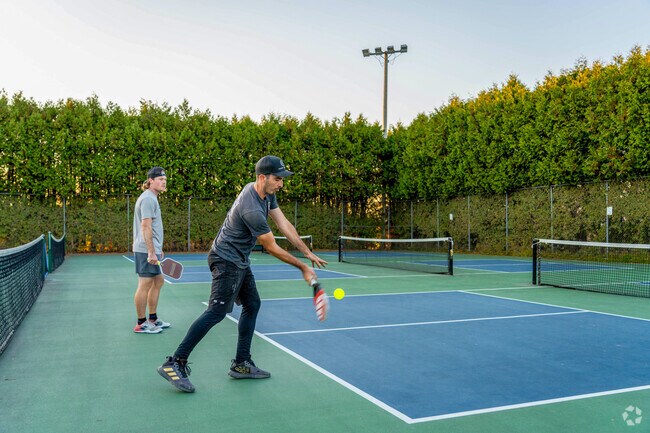 People play pickleball at the Barre Recreational tennis courts on the border of South Barre.
