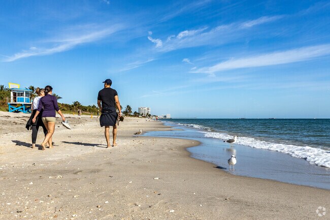 Take a morning walk with friends at Ft. Lauderdale Beach.
