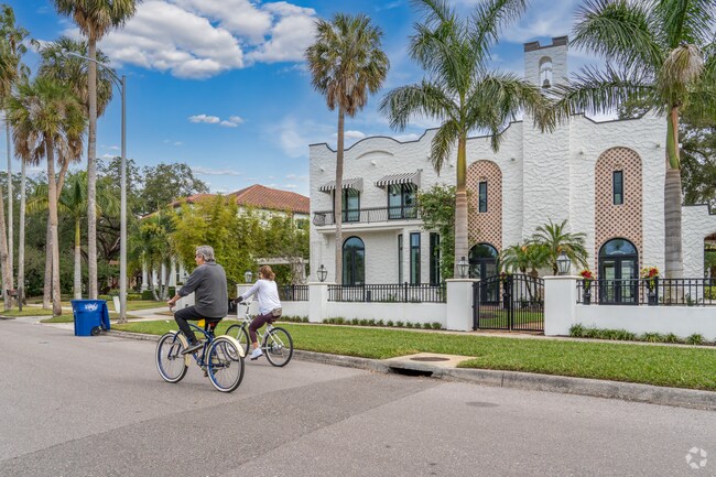 Neighbors take a bike ride through the streets of Beach Park.