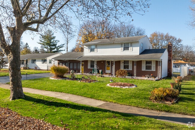 Colonial-inspired homes in Gates offer large covered front porches.
