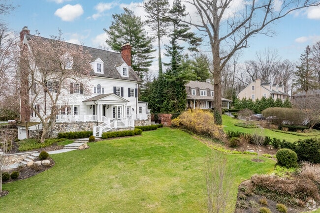 Contemporary Colonial homes are popular throughout the hilly neighborhood of Roslyn Estates.