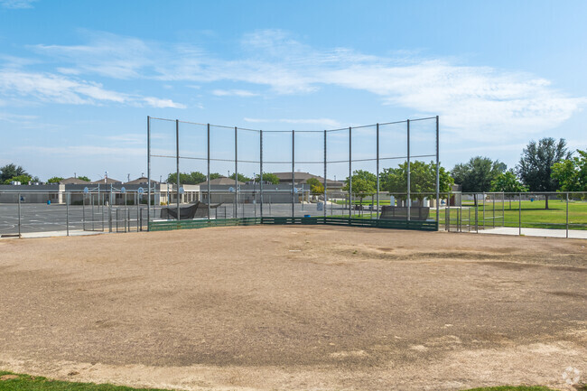 Students practice teamwork on the baseball field at James K. Polk Elementary in West Fresno.