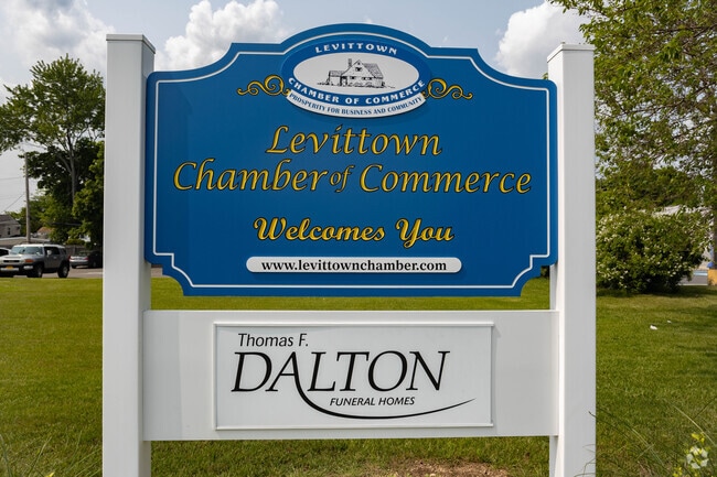 Levittown's Chamber of Commerce signs welcome visitors to Levittown, NY.