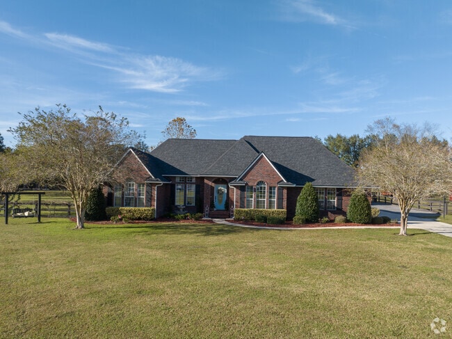 This brick home can be found in Deerwood Creek Estates.