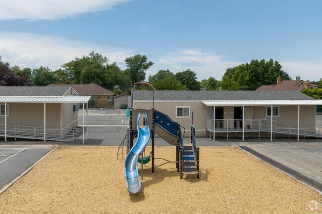A small blue playground at Highland Park Elementary School.