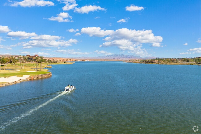 Lake Las Vegas locals can take a ride on a boat and enjoy the peaceful lake.