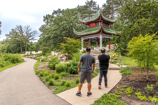 Visitors explore the friendship gardens at Phalen Regional Park.